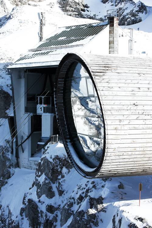 The mountain station in the Karwendel range above Mittenwald features ORNILUX® bird protection glass with UV-reflective patterns that prevent bird collisions while preserving clear, unobstructed alpine views.